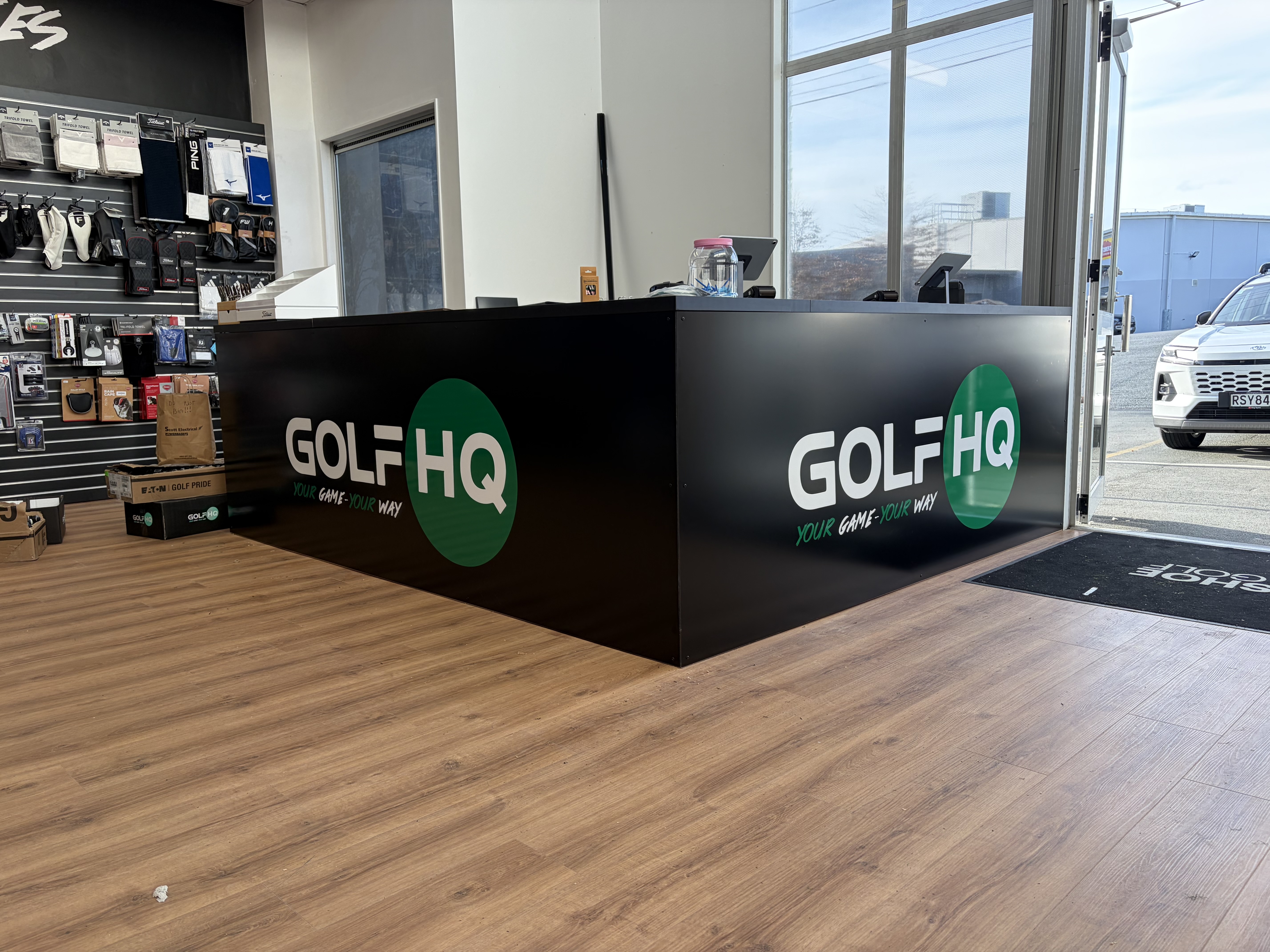 Golf HQ counter and point-of-sale signage